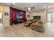 Spacious living room with large screen TV and aquarium at 21631 Cormorant Cove Dr, Land O Lakes, FL 34637