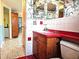 Bathroom with red vanity and tiled floors at 13916 Barnard Ave, Hudson, FL 34667