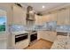 Updated kitchen with stainless steel appliances and granite countertops at 2628 River Bend Dr, Ruskin, FL 33570