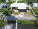 Aerial view of house with backyard, fire pit, and private dock at 2628 River Bend Dr, Ruskin, FL 33570