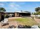 Large backyard with screened porch and firepit at 2628 River Bend Dr, Ruskin, FL 33570