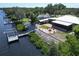 Aerial view showcasing house, expansive backyard and private dock at 2628 River Bend Dr, Ruskin, FL 33570