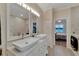 Bathroom with double vanity and walk-in shower at 2628 River Bend Dr, Ruskin, FL 33570