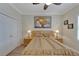 Bedroom with ceiling fan and double door closet at 2628 River Bend Dr, Ruskin, FL 33570