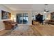 Relaxing living room with hardwood floors, large windows, and access to a covered patio at 2628 River Bend Dr, Ruskin, FL 33570