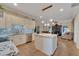 Open kitchen features granite island, stainless steel appliances, and hardwood floors at 2628 River Bend Dr, Ruskin, FL 33570