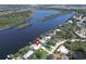 Aerial view of waterfront home with private dock and lush landscaping at 2628 River Bend Dr, Ruskin, FL 33570