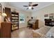 Home office with built-in bookcases and a comfortable daybed at 2628 River Bend Dr, Ruskin, FL 33570