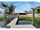 Steps leading from the dock to the waterfront at 2628 River Bend Dr, Ruskin, FL 33570