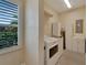 Laundry room with washer, dryer, and extra storage at 2628 River Bend Dr, Ruskin, FL 33570