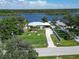 Aerial view of a single story home with a large yard and water access at 2628 River Bend Dr, Ruskin, FL 33570