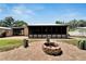 Backyard with firepit and screened porch at 2628 River Bend Dr, Ruskin, FL 33570