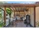Covered outdoor kitchen with built-in grill and smoker at 2628 River Bend Dr, Ruskin, FL 33570