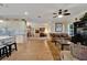 Open concept living area with hardwood floors, kitchen, and access to the dining area at 2628 River Bend Dr, Ruskin, FL 33570