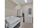 Bright laundry room with washer, dryer, and cabinets at 2628 River Bend Dr, Ruskin, FL 33570