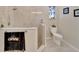 Bathroom with walk-in shower and toilet at 2628 River Bend Dr, Ruskin, FL 33570