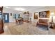 Open concept dining area with hardwood floors and access to the living room and kitchen at 2628 River Bend Dr, Ruskin, FL 33570