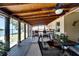 Spacious screened-in porch with water views and ample seating at 2628 River Bend Dr, Ruskin, FL 33570
