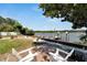 Relaxing patio overlooking the water with seating and fire pit at 2628 River Bend Dr, Ruskin, FL 33570