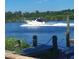 Boat passing by a waterfront property at 2628 River Bend Dr, Ruskin, FL 33570