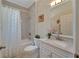 Clean bathroom with a bathtub, shower, and updated vanity at 2628 River Bend Dr, Ruskin, FL 33570