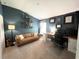Home office with a leather couch and workspace at 4801 Cypress Club Pl, Tampa, FL 33624