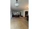 Open living and dining area with neutral carpeting and a view of the kitchen at 4458 Maverick St, North Port, FL 34288
