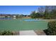 Enjoy outdoor activities with the neighborhood basketball court next to the lake at 16321 Treasure Point Dr, Wimauma, FL 33598