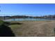 Community tennis court ready for some match play, overlooking the neighborhood lake at 16321 Treasure Point Dr, Wimauma, FL 33598