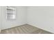 Cozy carpeted bedroom with natural light from a window with blinds at 9413 Ballaster Pointe Loop, Parrish, FL 34219