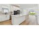 Spacious kitchen with a center island, stainless steel appliances, and open access to the living area at 9413 Ballaster Pointe Loop, Parrish, FL 34219