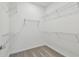 Walk-in closet with neutral carpet and white wire shelving for ample storage at 9421 Ballaster Pointe Loop, Parrish, FL 34219
