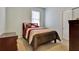 Comfortable bedroom with a full-size bed and dresser at 16321 Treasure Point Dr, Wimauma, FL 33598