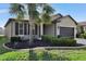 One-story house with a two-car garage and landscaping at 16321 Treasure Point Dr, Wimauma, FL 33598