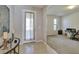 Bright entryway with view into home office at 16321 Treasure Point Dr, Wimauma, FL 33598