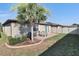 Small backyard with patio and palm tree at 16321 Treasure Point Dr, Wimauma, FL 33598
