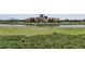 Community center with lake view and playground at 16321 Treasure Point Dr, Wimauma, FL 33598
