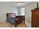 Cozy bedroom with a sleigh bed and neutral color scheme at 16321 Treasure Point Dr, Wimauma, FL 33598