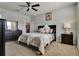 Bright bedroom featuring a comfortable bed and ample space at 16321 Treasure Point Dr, Wimauma, FL 33598
