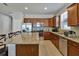 Spacious kitchen with granite countertops, stainless steel appliances, and ample cabinetry at 16321 Treasure Point Dr, Wimauma, FL 33598