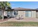 Brick patio and seating area in backyard at 16321 Treasure Point Dr, Wimauma, FL 33598