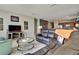 Spacious living room with sectional sofa, and views to the kitchen and backyard at 16321 Treasure Point Dr, Wimauma, FL 33598