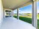 Covered back porch overlooking beautiful community pond at 11818 Tetrafin Dr, Riverview, FL 33579