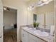 Bathroom featuring double sinks, granite countertop, and ample lighting at 11818 Tetrafin Dr, Riverview, FL 33579