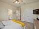 Bedroom with closet and ensuite bathroom, with wood look flooring at 11818 Tetrafin Dr, Riverview, FL 33579