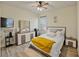 Cozy bedroom featuring a comfy bed, dresser with mirror, and modern decor at 11818 Tetrafin Dr, Riverview, FL 33579