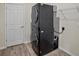 Laundry room with stacked washer and dryer unit, plus wire shelving at 11818 Tetrafin Dr, Riverview, FL 33579