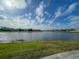 Peaceful lake view showcasing the serene waterfront and surrounding community at 11818 Tetrafin Dr, Riverview, FL 33579