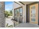 Balcony view featuring a modern railing and a bright yellow door at 2509 N Glenwood Dr, Tampa, FL 33602
