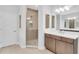 Well-lit bathroom showcasing a glass-enclosed shower, modern vanity with sleek finishes, and ample counter space at 2509 N Glenwood Dr, Tampa, FL 33602